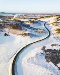 A long and winding road covered in snow in Iceland during winter