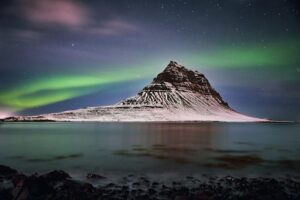 The northern lights over Kirkjufell mountain in Iceland during winter