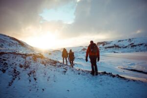 People hiking in the snow in Iceland during winter