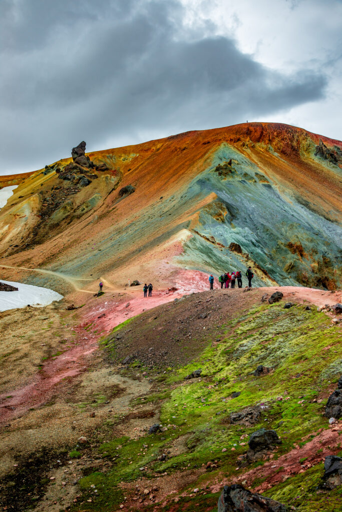 Beautiful colorful volcanic mountains Landmannalaugar and hikers on trail, Iceland