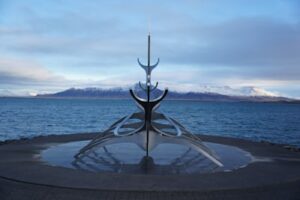 The Sun Voyager sculpture in Reykjavik with Esja in the background