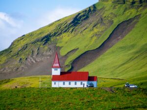 The church in Vík under the Midnight Sun in Iceland