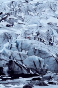 A family group taking a Glacier Hike in Iceland