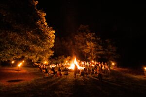 A group telling stories by the fire in Iceland