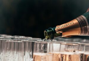 Pouring a glass of champagne to toast your proposal in Iceland