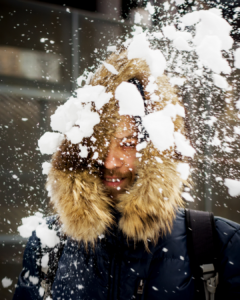 A man having a fun snowball fight in Iceland