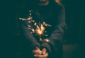 A young girl holding a sparkler on New Years Eve in Iceland