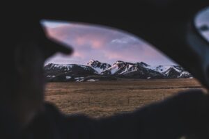 Driving past a mountain range in Iceland at dusk