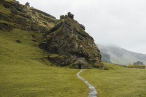 An old Viking house in Iceland built into the side of a rockface