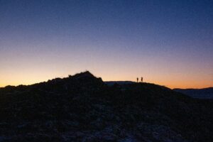 A couple on a Hike in Iceland under a dusky sky